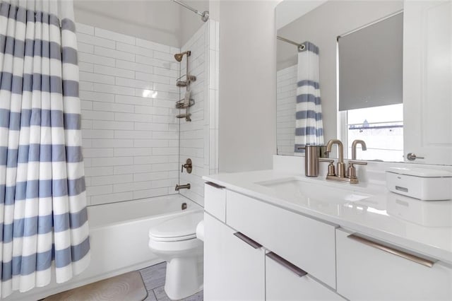 full bathroom featuring toilet, vanity, and shower / tub combo with curtain