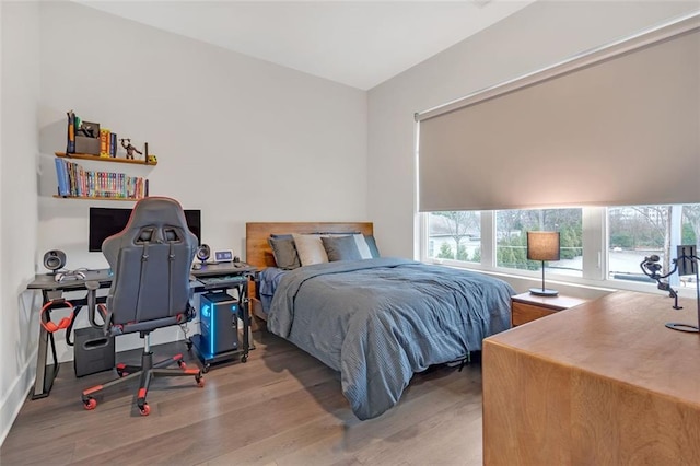 bedroom with light hardwood / wood-style floors