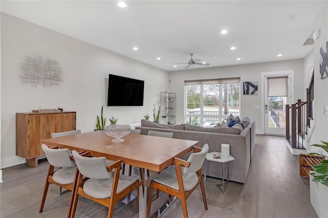 dining area featuring ceiling fan and light wood-type flooring