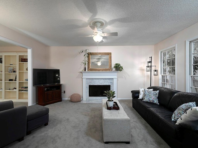 4601 Gann Xing SW, Smyrna, GA 30082 - living area with ceiling fan, carpet floors, a fireplace, and a textured ceiling