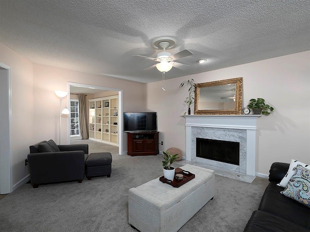 4601 Gann Xing SW, Smyrna, GA 30082 - living area featuring ceiling fan, a fireplace, carpet, and a textured ceiling