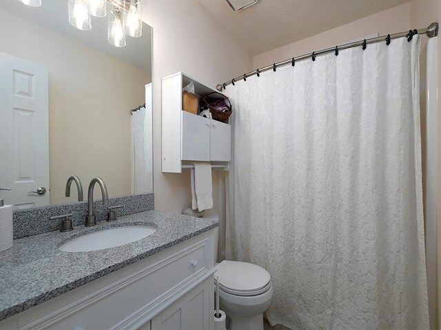 4601 Gann Xing SW, Smyrna, GA 30082 - full bathroom with vanity and a textured ceiling