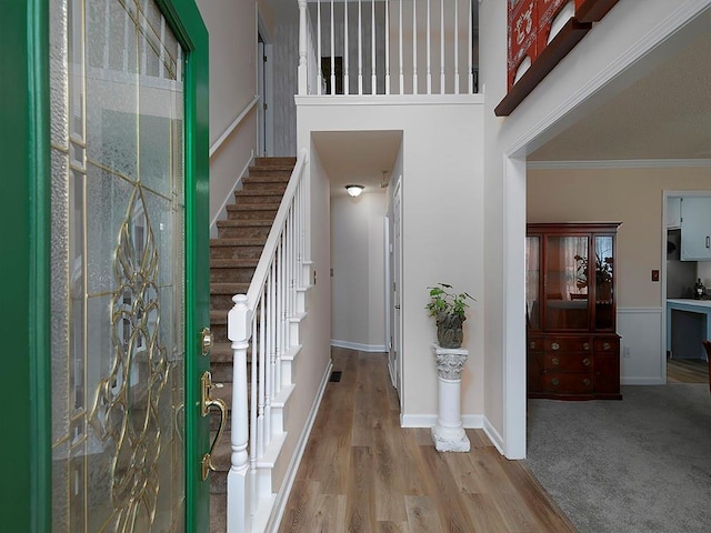 4601 Gann Xing SW, Smyrna, GA 30082 - foyer entrance featuring stairway, crown molding, and wood finished floors