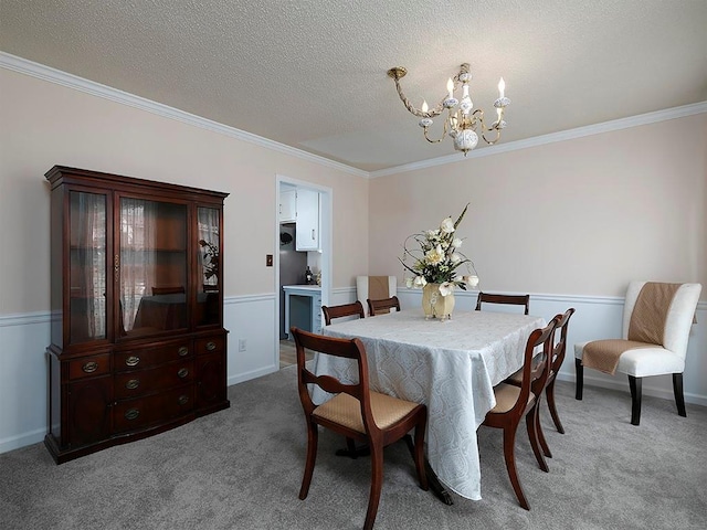 4601 Gann Xing SW, Smyrna, GA 30082 - dining area featuring a chandelier, crown molding, carpet floors, and a textured ceiling