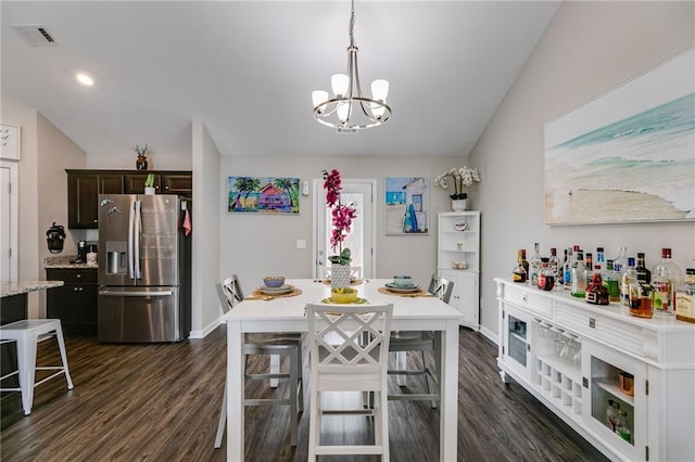 dining area featuring a chandelier, dark wood-type flooring, baseboards, and recessed lighting