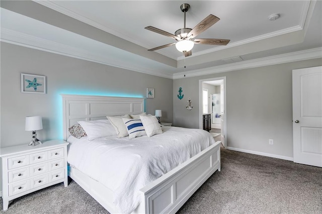 bedroom with a tray ceiling, carpet floors, ornamental molding, baseboards, and ceiling fan