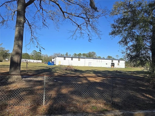 rear view of property with fence