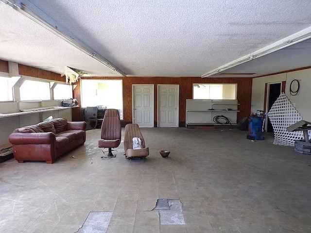 living area featuring a textured ceiling
