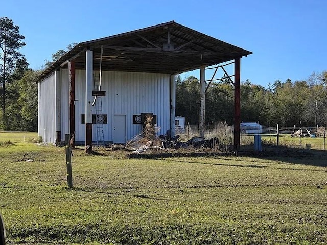 view of outdoor structure featuring fence