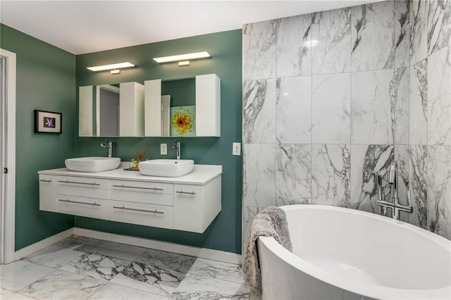 951 Glenwood Ave SE Unit 1805, Atlanta, GA 30316 - full bath featuring baseboards, marble look tile flooring, a soaking tub, and double vanity