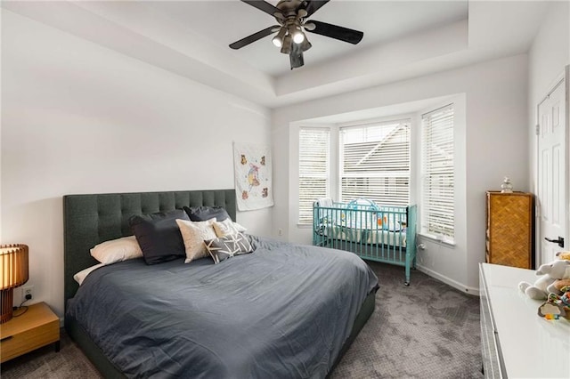 951 Glenwood Ave SE Unit 1805, Atlanta, GA 30316 - carpeted bedroom featuring a raised ceiling, baseboards, and a ceiling fan