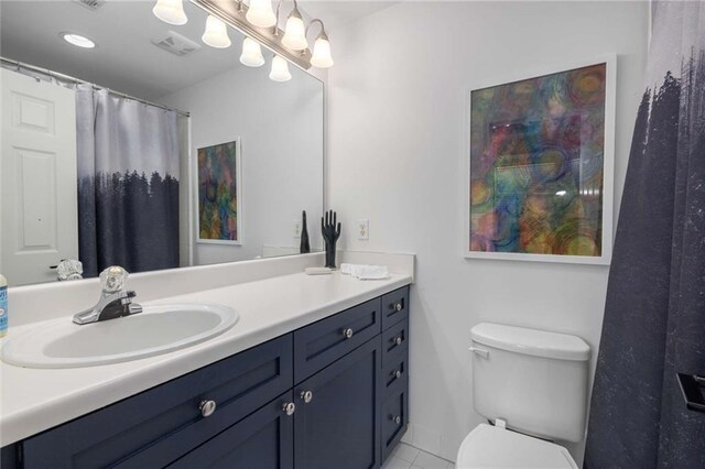 951 Glenwood Ave SE Unit 1805, Atlanta, GA 30316 - bathroom featuring toilet, tile patterned floors, and vanity
