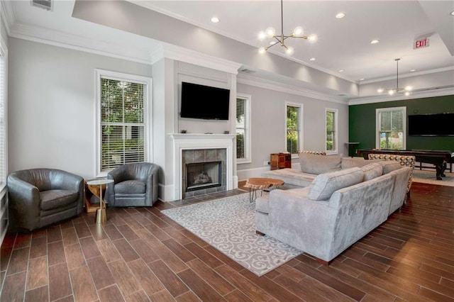 951 Glenwood Ave SE Unit 1805, Atlanta, GA 30316 - living area featuring a raised ceiling, a chandelier, a fireplace, crown molding, and dark wood-type flooring