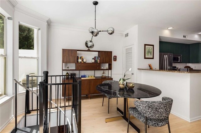 951 Glenwood Ave SE Unit 1805, Atlanta, GA 30316 - dining area with light wood-style floors, recessed lighting, and ornamental molding