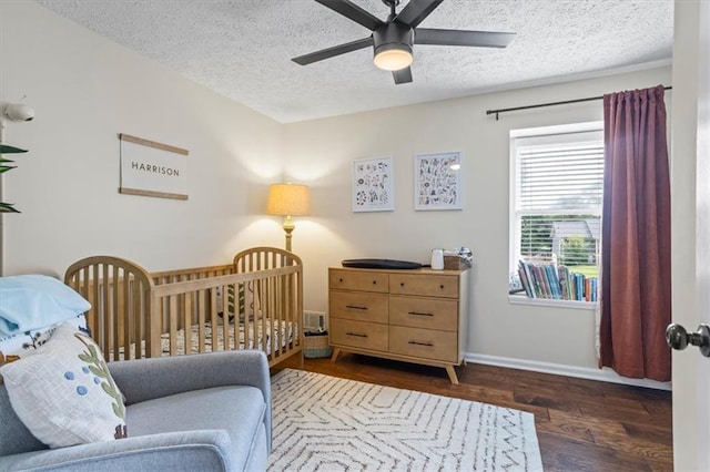 110 Village Ct, Woodstock, GA 30188 - bedroom featuring wood finished floors, a textured ceiling, and a ceiling fan