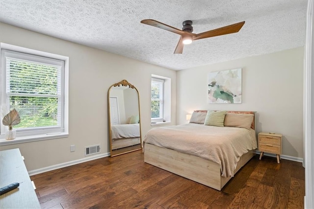 110 Village Ct, Woodstock, GA 30188 - bedroom featuring a textured ceiling, wood finished floors, and a ceiling fan