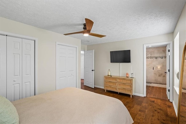 110 Village Ct, Woodstock, GA 30188 - bedroom featuring dark wood finished floors, two closets, ceiling fan, ensuite bath, and a textured ceiling