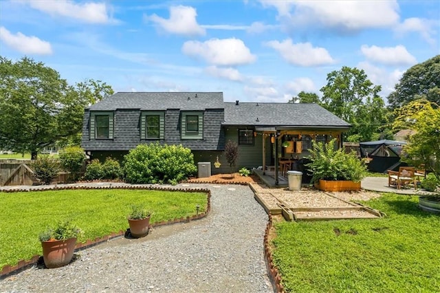 110 Village Ct, Woodstock, GA 30188 - rear view of house with a patio and a shingled roof