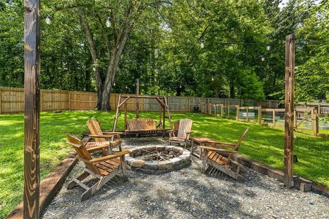 110 Village Ct, Woodstock, GA 30188 - fenced backyard with an outdoor fire pit and view of scattered trees