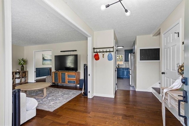 110 Village Ct, Woodstock, GA 30188 - living area with a textured ceiling and dark wood-style floors
