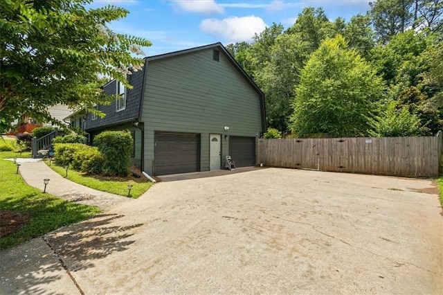110 Village Ct, Woodstock, GA 30188 - view of home's exterior featuring concrete driveway and an attached garage