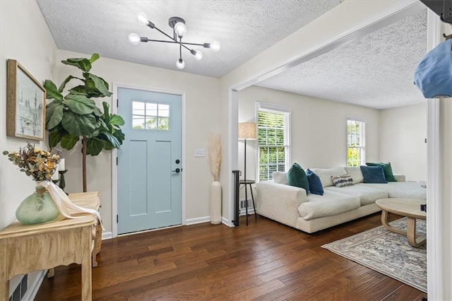 110 Village Ct, Woodstock, GA 30188 - entrance foyer featuring a textured ceiling, healthy amount of natural light, a chandelier, and hardwood / wood-style flooring