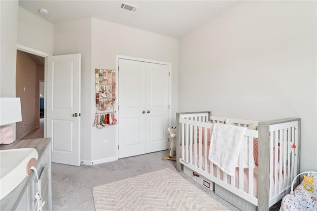 66 Cottontail Ln, Loganville, GA 30052 - bedroom with light carpet, a closet, and baseboards