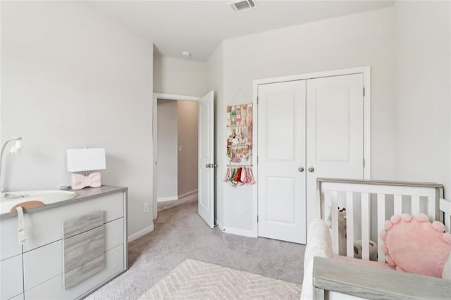 66 Cottontail Ln, Loganville, GA 30052 - bedroom with light carpet, a closet, and baseboards