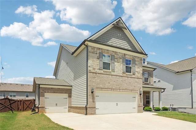 66 Cottontail Ln, Loganville, GA 30052 - view of front of house featuring concrete driveway, brick siding, an attached garage, and a front lawn