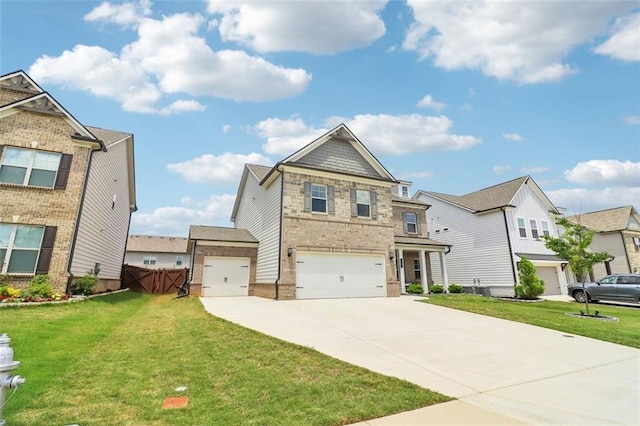66 Cottontail Ln, Loganville, GA 30052 - view of front of house featuring concrete driveway, brick siding, an attached garage, and a front lawn