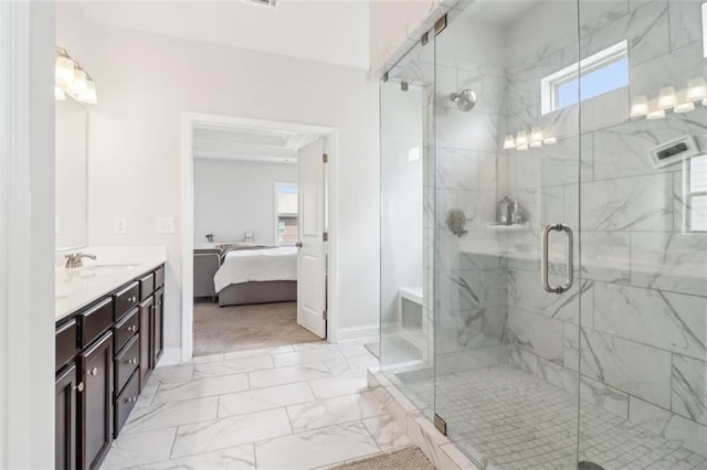 66 Cottontail Ln, Loganville, GA 30052 - bathroom featuring marble look tiles, a stall shower, baseboards, and double vanity