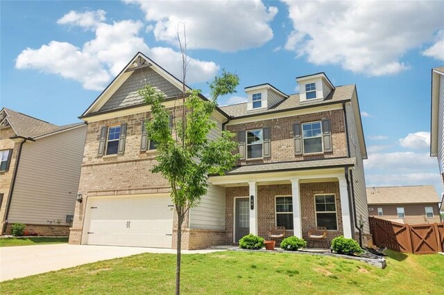 66 Cottontail Ln, Loganville, GA 30052 - craftsman house featuring board and batten siding, an attached garage, concrete driveway, and a residential view