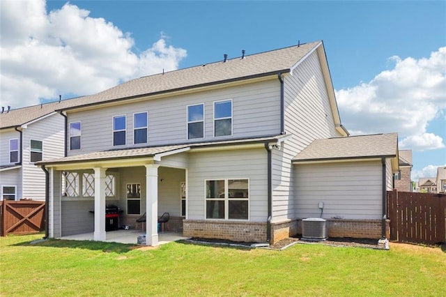 66 Cottontail Ln, Loganville, GA 30052 - back of house featuring a patio area, brick siding, and central AC