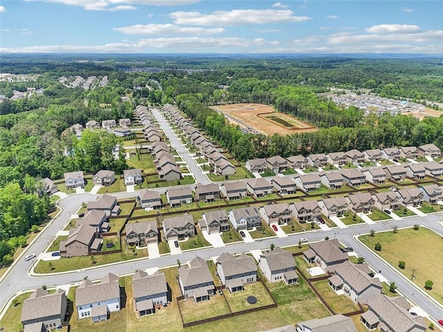 66 Cottontail Ln, Loganville, GA 30052 - aerial view of property and surrounding area with a forest and nearby suburban area