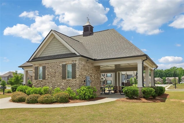 66 Cottontail Ln, Loganville, GA 30052 - rear view of property featuring brick siding, a yard, and a shingled roof