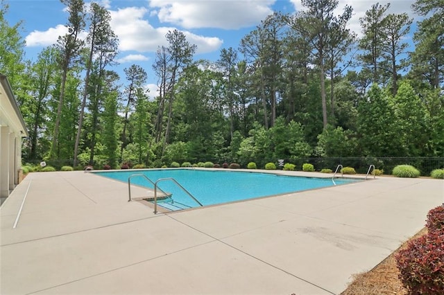 66 Cottontail Ln, Loganville, GA 30052 - community pool featuring a patio area and fence