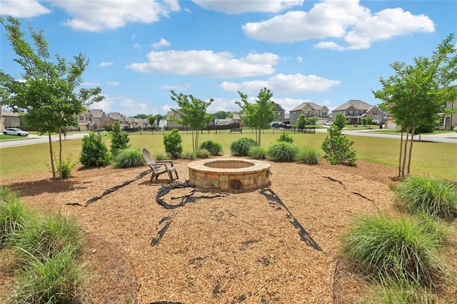 66 Cottontail Ln, Loganville, GA 30052 - view of green lawn with a residential view and a fire pit