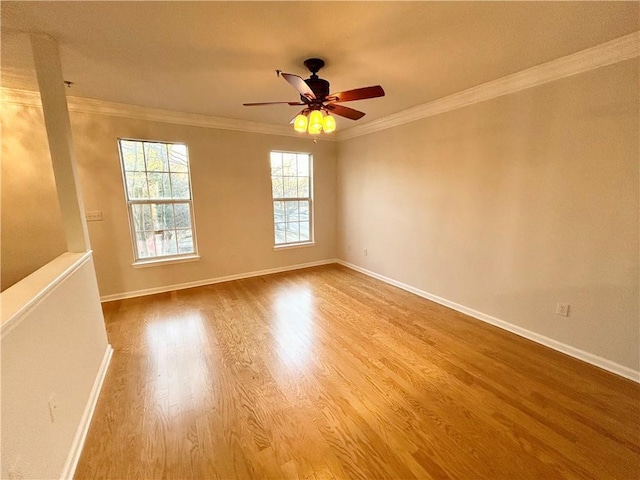 unfurnished room featuring ornamental molding, hardwood / wood-style floors, and ceiling fan