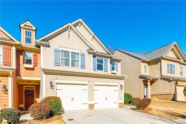 townhome / multi-family property featuring a garage