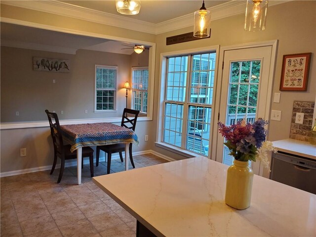 dining space featuring ceiling fan, ornamental molding, and baseboards