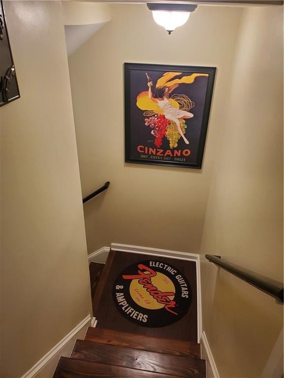 stairway featuring baseboards