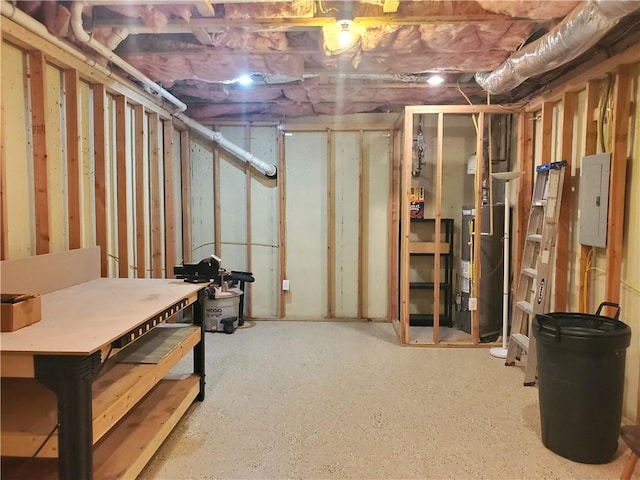 unfinished basement featuring electric panel and water heater