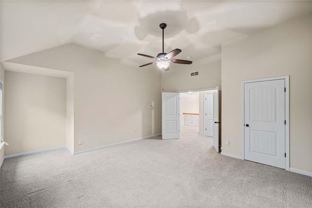 unfurnished bedroom with lofted ceiling, light carpet, and ceiling fan