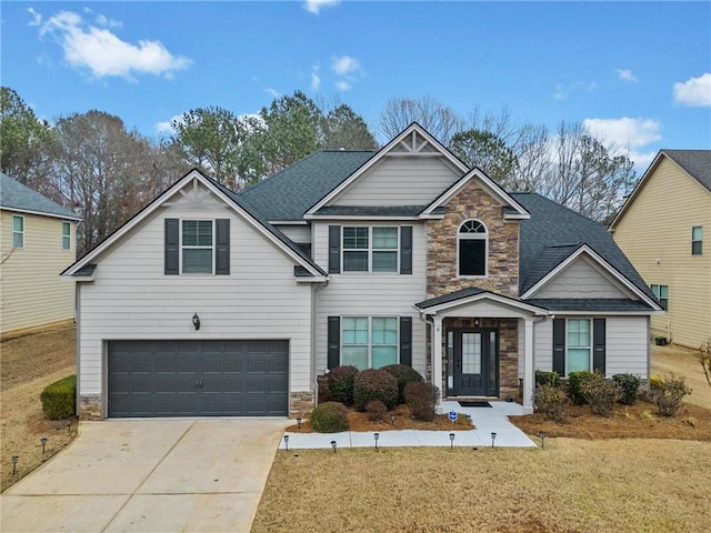 view of front of house with a garage and a front lawn