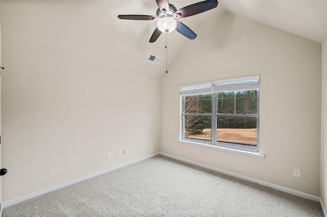 carpeted empty room with high vaulted ceiling and ceiling fan