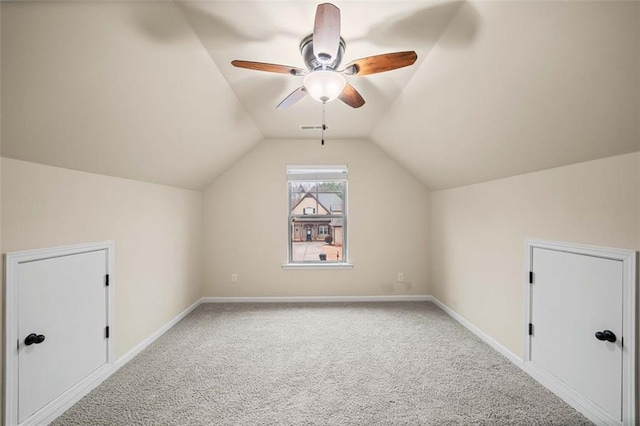 additional living space with lofted ceiling, carpet floors, and ceiling fan