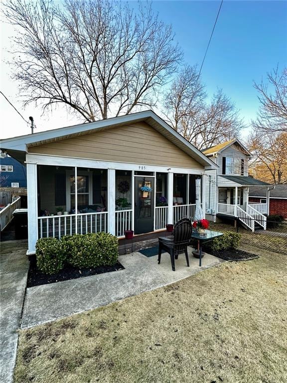 rear view of house with a yard