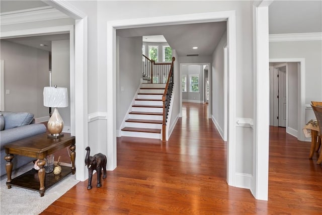 interior space with crown molding and hardwood / wood-style floors