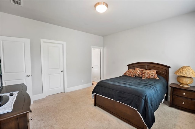 bedroom with light carpet