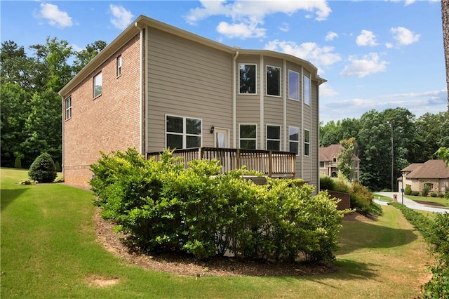 view of side of home featuring a yard